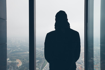 Back portrait man looking to city from top. View on Istanbul from observation desk