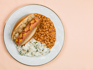 Hot Dog in a Bun with Baked Beans and Potato Salad