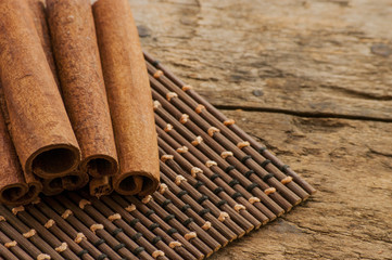 cinnamon on wooden background and coffee