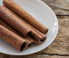 cinnamon on wooden background and coffee