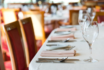 fork and knife on a napkin with plate.