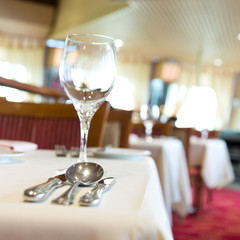 fork and knife on a napkin with plate.