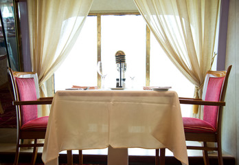 Empty tables at a luxury cruise restaurant