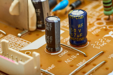 Resistors, capacitors and other electronic components of micro chip inside the computer close up