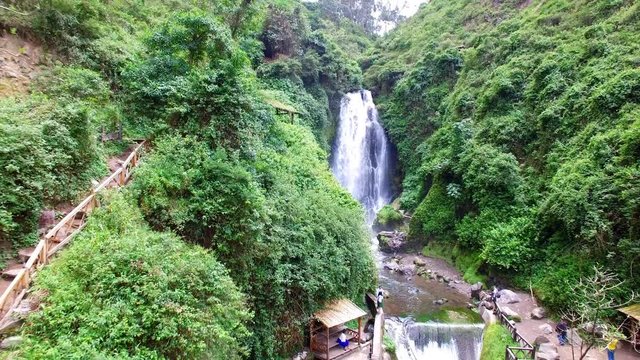 Aerial view of Peguche Waterfall, Rain Forest, drone's perspective, Otavalo, Ecuador