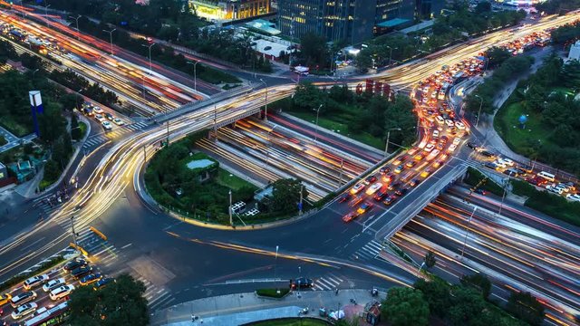 4K video(zoom out): Aerial View of freeway busy city rush hour heavy traffic jam highway. Timelapse .