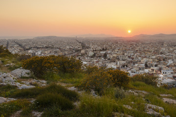 View of Athens from Filopappou hill at sunset, Greece. 
