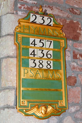 Hymns and Psalms board inside church to inform congregation of the hymns and psalms that will be part of the days service