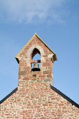 Fototapeta na wymiar The bell tower at Saint Nicholas Church Ringmore in the Parish of Shaldon in Devon England