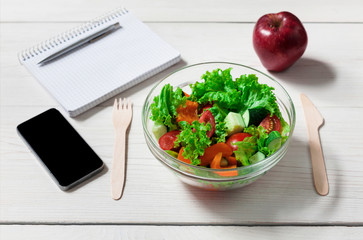Healthy business lunch snack in office, vegetable salad top view