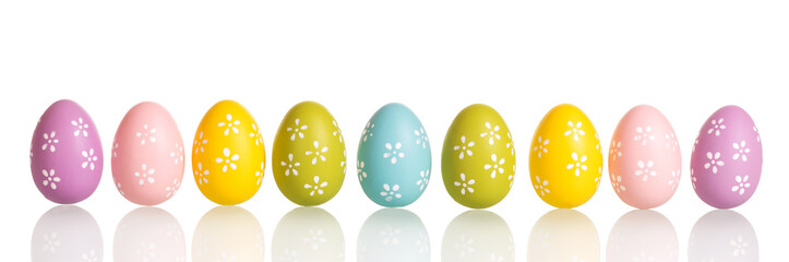 Row of colorful Easter eggs isolated on white.