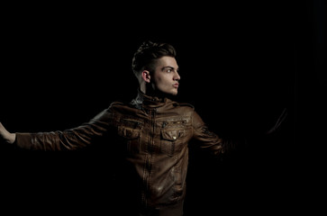 Fototapeta na wymiar Handsome man posing in brown, leather jacket
