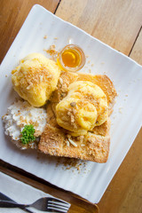 honey Toast and ice cream on white dish wood table