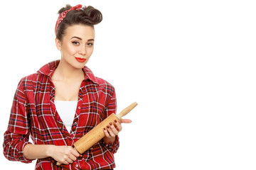 Beautiful pinup girl with a rolling pin