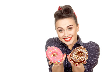 Happy young pinup woman posing with donuts