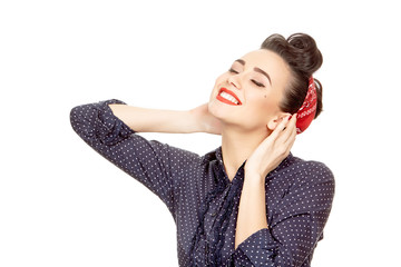 Young happy pinup girl in a dotted dress