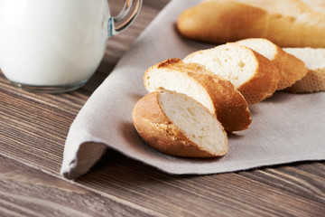 Sliced bread on the wooden plank