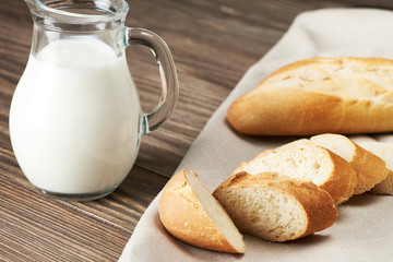 Sliced bread on the wooden plank