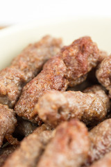 Closeup macro fresh minced meat cevapcici kebabs