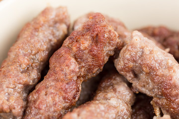 Closeup macro fresh minced meat cevapcici kebabs