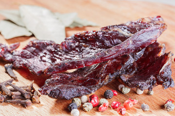 Pieces of beef jerky and spices