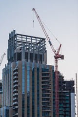 Fototapeta na wymiar Construction Crane with Blue Sky