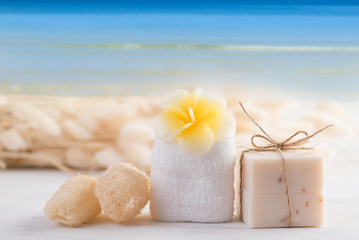 Obraz na płótnie Canvas Spa aromatherapy products with blue sea sky background background