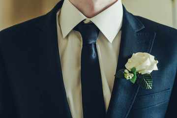 men suit perfect to the last detail. Man posing in classic suit with white shirt