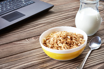 Healthy breakfast and laptop before work