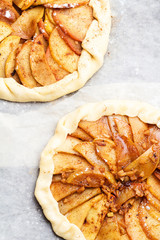Biscuits with apples, cinnamon, powdered sugar and ginger before baking.