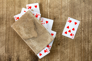 Old book and playing cards