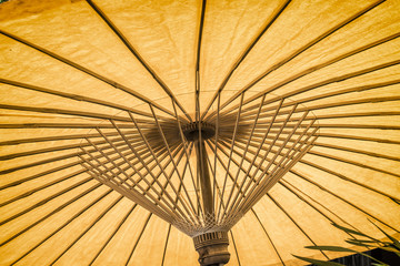 Orange Umbrella Paper open and sun use to background.