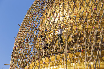 Worker repareing golden temple