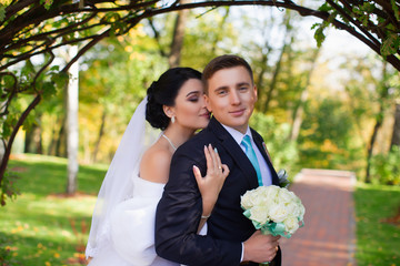 The bride has tenderly embraced the groom