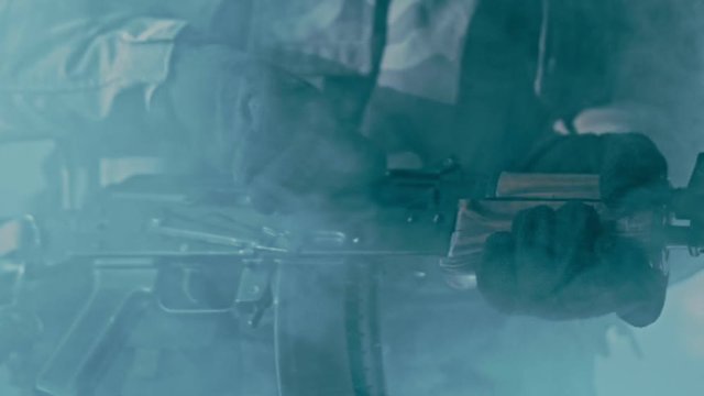 Change rifle cartridge in aksu. Assault rifle kalashnikov shutter. Reloading aks 74. Close up of soldier reloading kalashnikov rifle. Weapon removing fuse