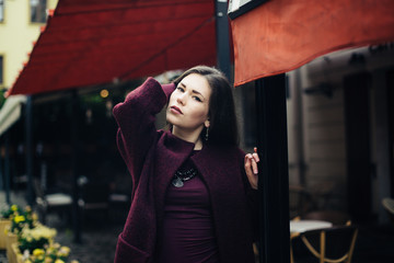  young woman in  coat posing