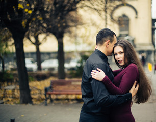 happy couple posing in  city