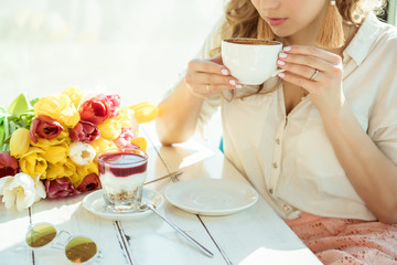 Obraz na płótnie Canvas Morning. Girl with a Cup of coffee and yogurt
