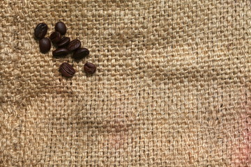 Coffee beans put on sack or gunny sack brown color represent texture surface background.