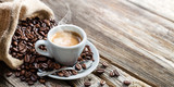 Espresso Coffee Cup With Beans On Vintage Table
