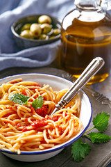 Italian pasta dish. Vegetarian spaghetti pasta with tomato sauce and olives