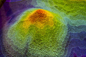 Mountain topography map in sand