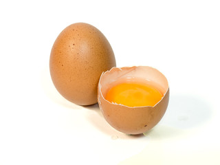 Cracked Egg with Yolk isolated on White Background