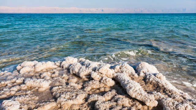 pieces of salt close up on beach of Dead Sea