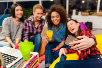 Beaming girls doing self-portrait photo