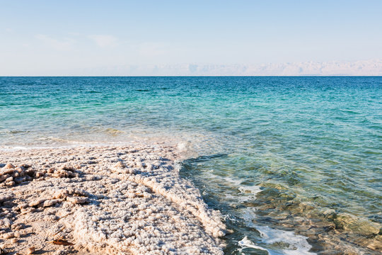 salt waterfront of Dead Sea in sunny winter day