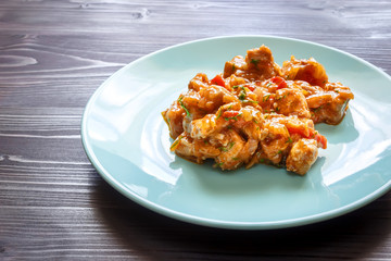 Meat stew on a blue plate