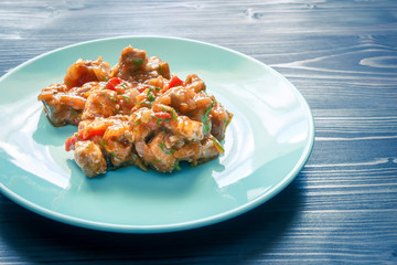 Meat stew on a blue plate