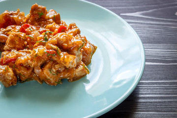 Meat stew on a blue plate