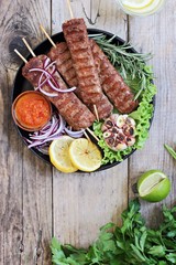 Kebab .Traditional  meat kebab of minced beef or lamb with vegetables and herbs .Selective focus